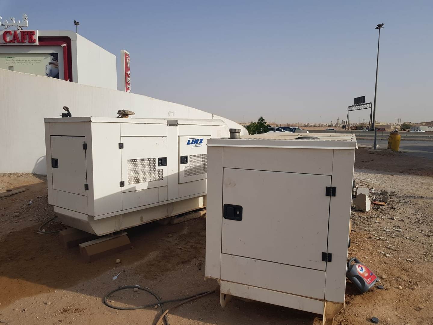 White Dream diesel generators deployed near commercial site wall