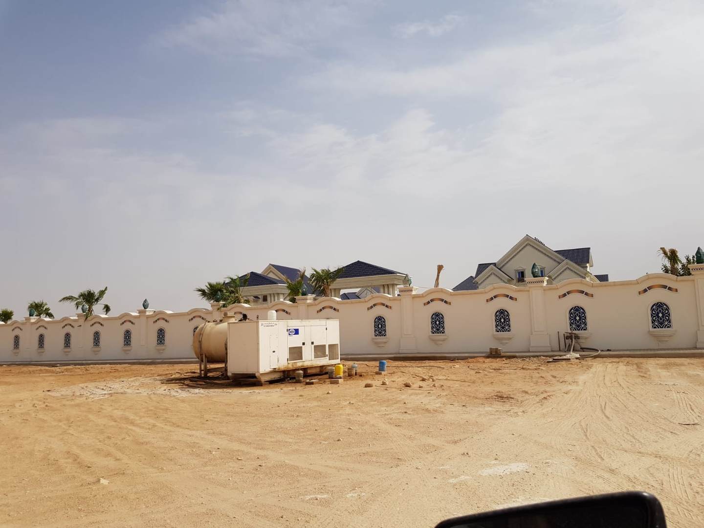 Generator and fuel tank installed outside villa boundary wall