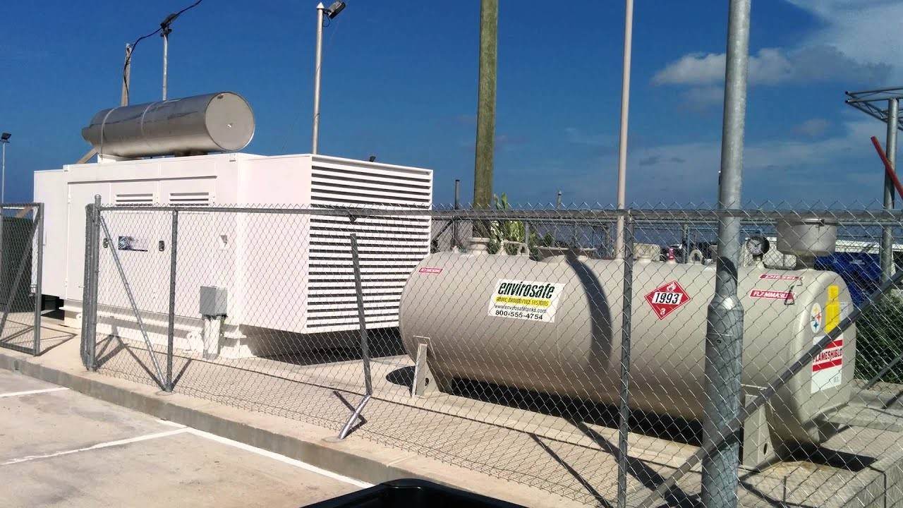Bunded above ground diesel fuel tank beside a generator in Saudi Arabia