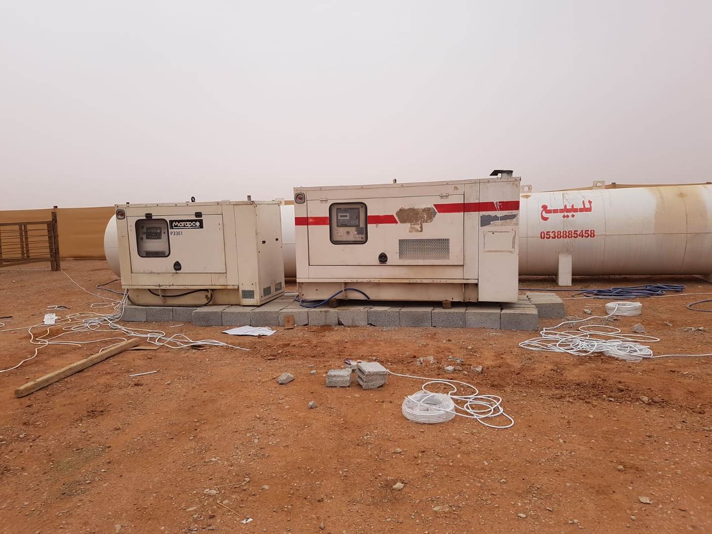 White Dream diesel generators set up and cabled on a project site in Saudi Arabia